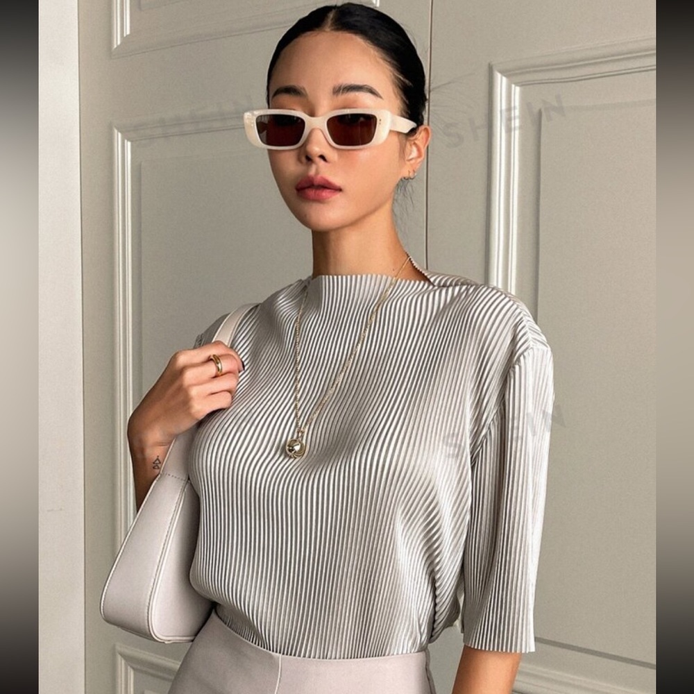 Drop shoulder accordion pleat top